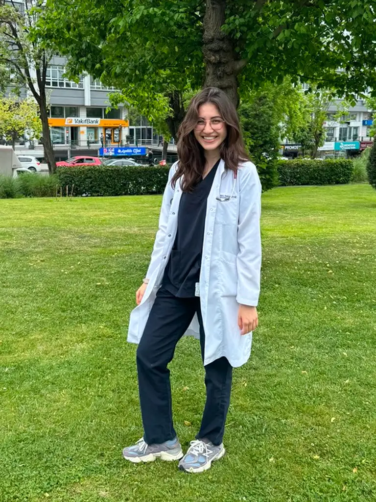 Dr.A standing in the garden with Doctors suit